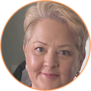 Portrait of a middle-aged woman with short blonde hair and a subtle smile.